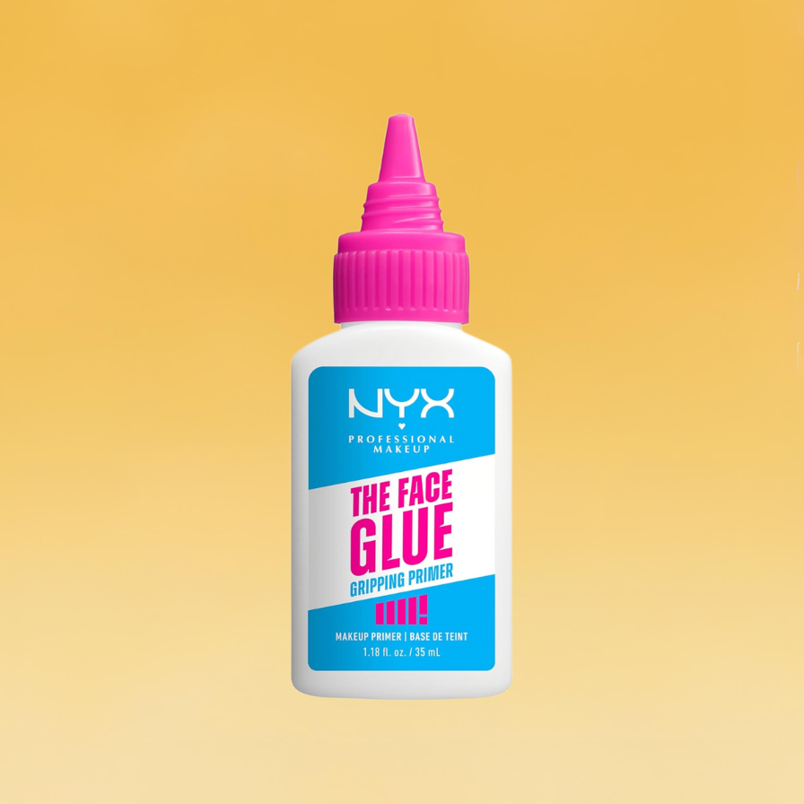A white, pink and blue bottle of NYX The Face Glue Primer sits against the yellow Body+Mind background. It's one of the best drugstore beauty products.