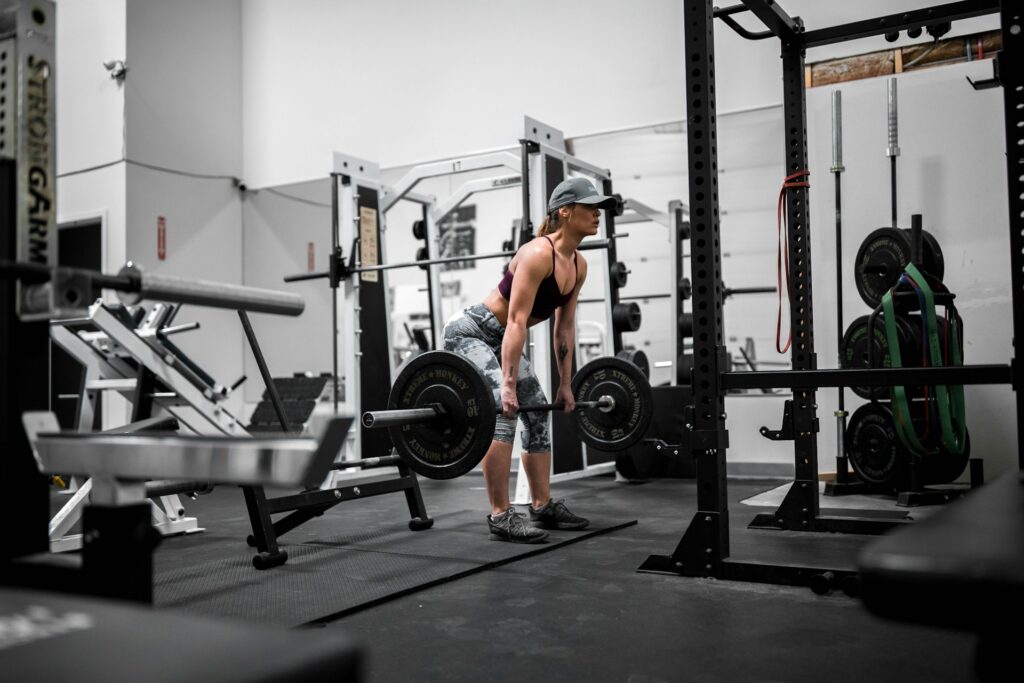 A woman doing barbell rows.