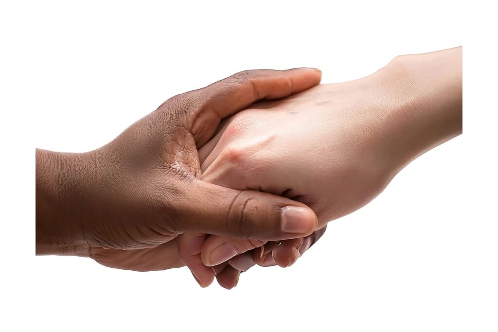An extreme closeup of wo people holding hands