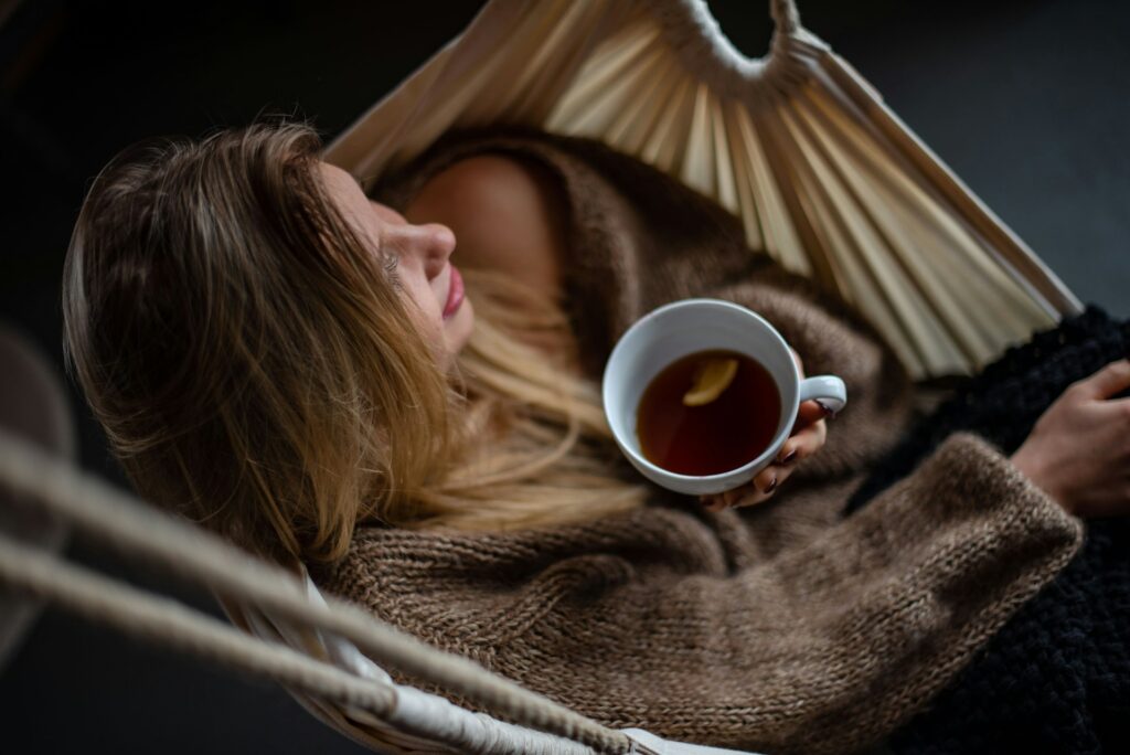 Woman enjoying a cup of herbal tea
