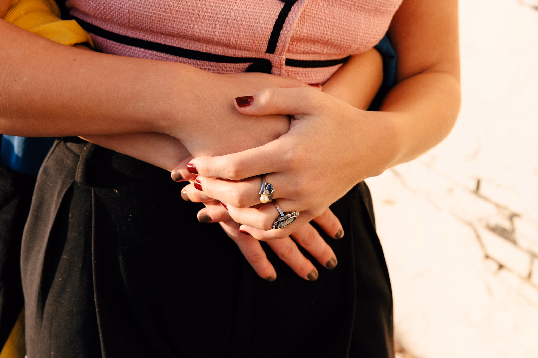 woman holding hands in front of her tummy