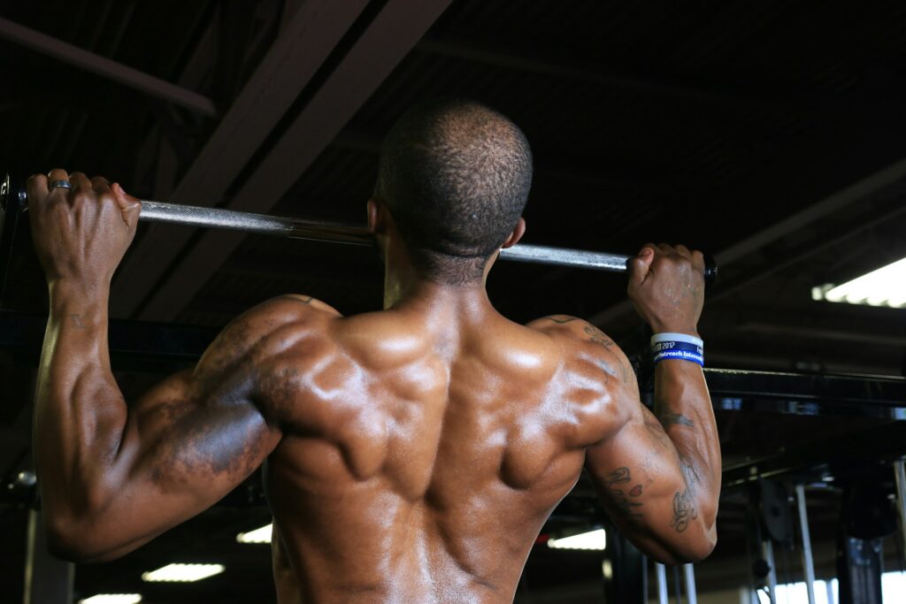 A man doing unassisted pull-ups.