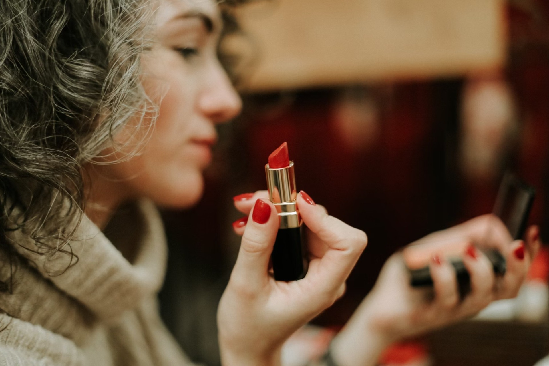 woman swiping lipstick