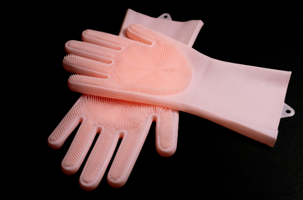 Wearing gloves when washing dishes can protect your skin.