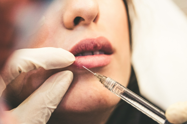 Woman getting injection and the botox and empathy world awaits.