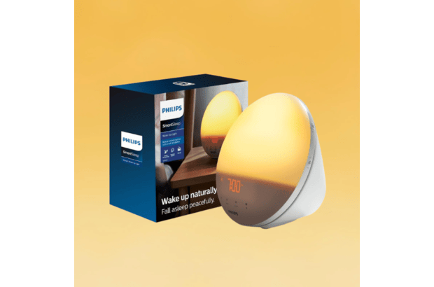 A Philips SmartSleep Wake-Up Light sunrise alarm clock with its box