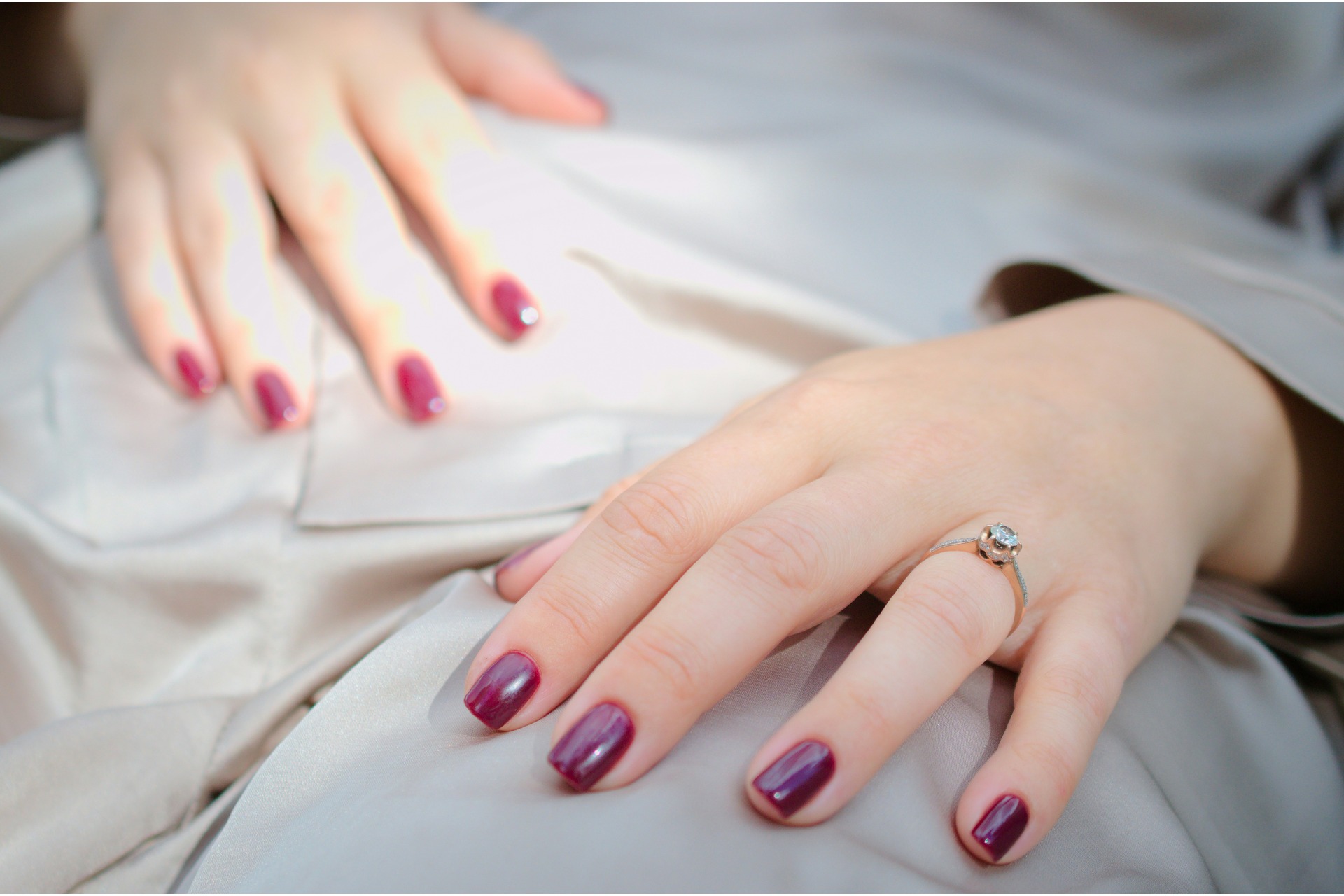 A woman with deep red nails
