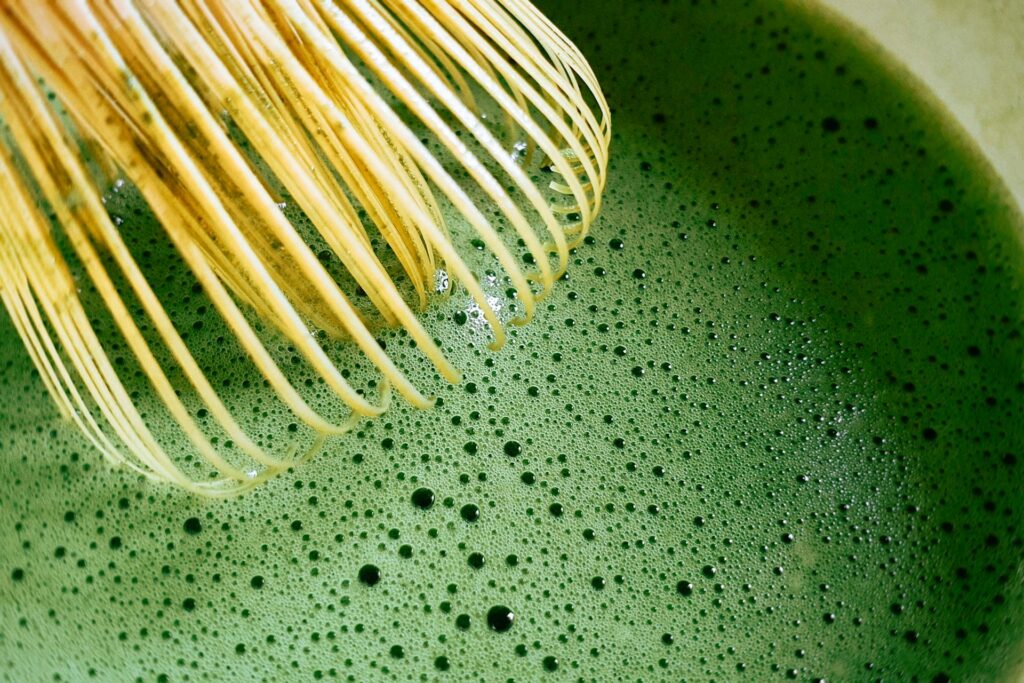 Matcha with a whisk.