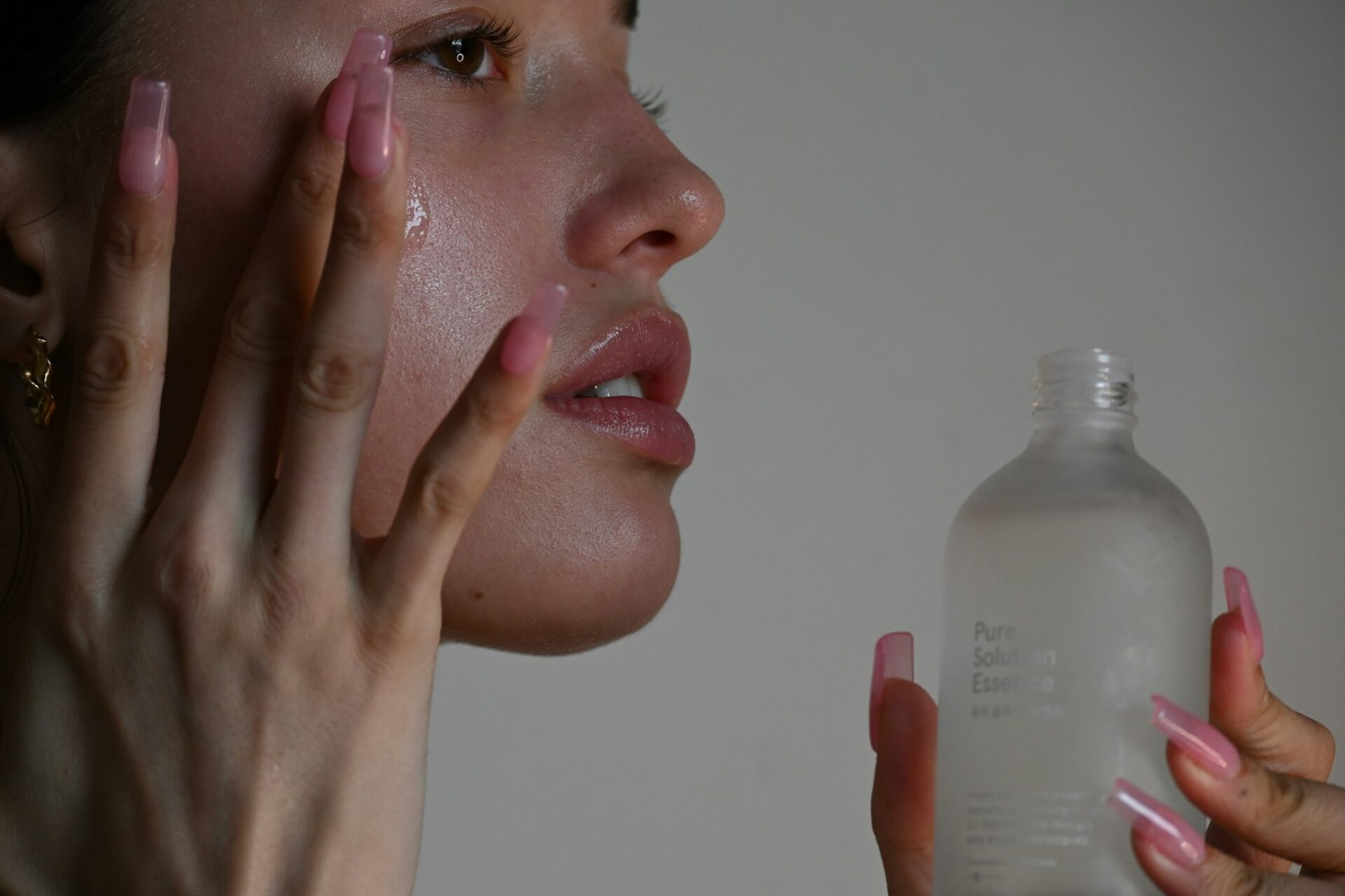 woman applying skin care product