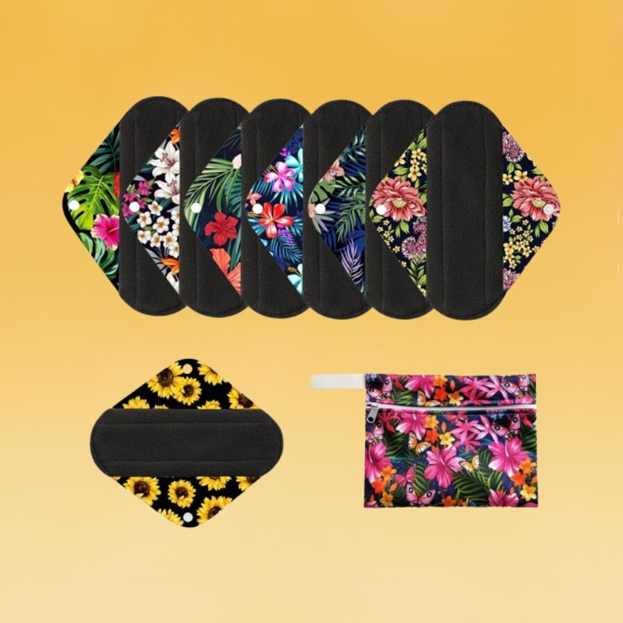 A set of black reusable cloth period pads with wings in different patterns sits against the Body+Mind branded background.