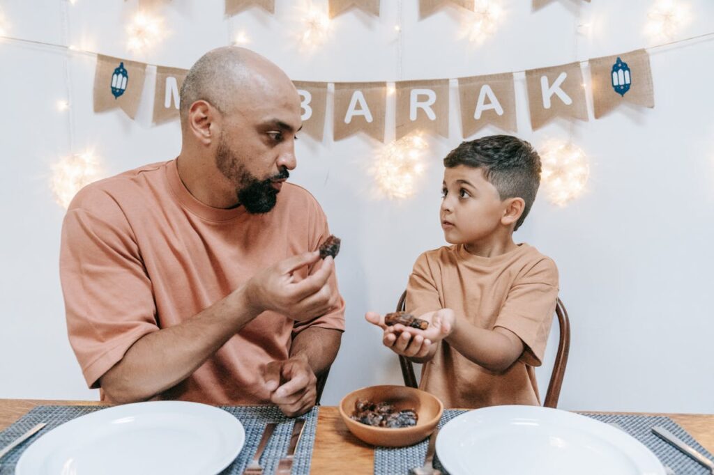 Father and Son Sitting at the Table
