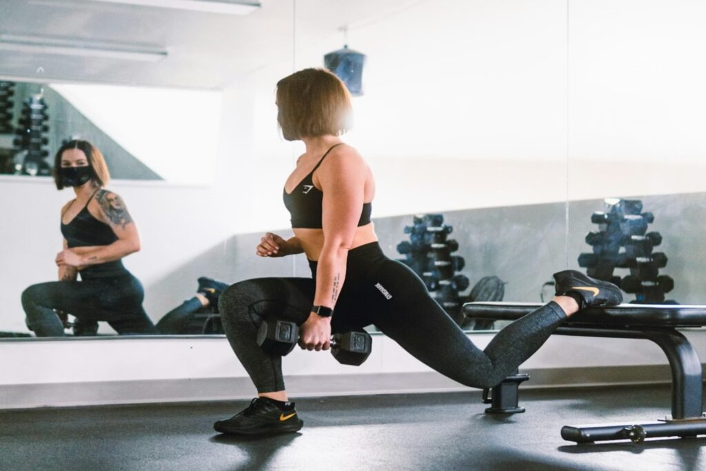 A woman doing a split squat