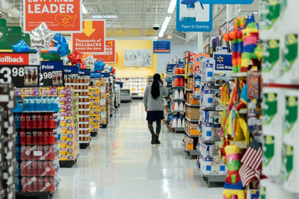 Man walking through the aisles of a grocery store