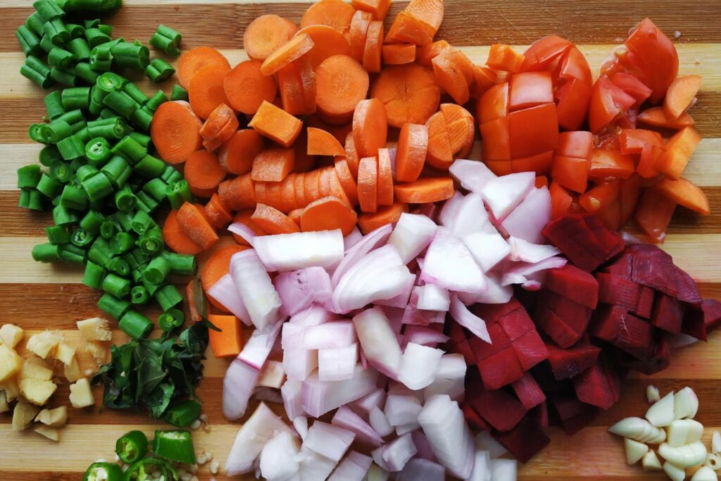 Colorful sliced vegetables on a cutting board