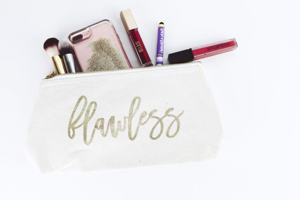 a make-up purse with different lipsticks and brushes