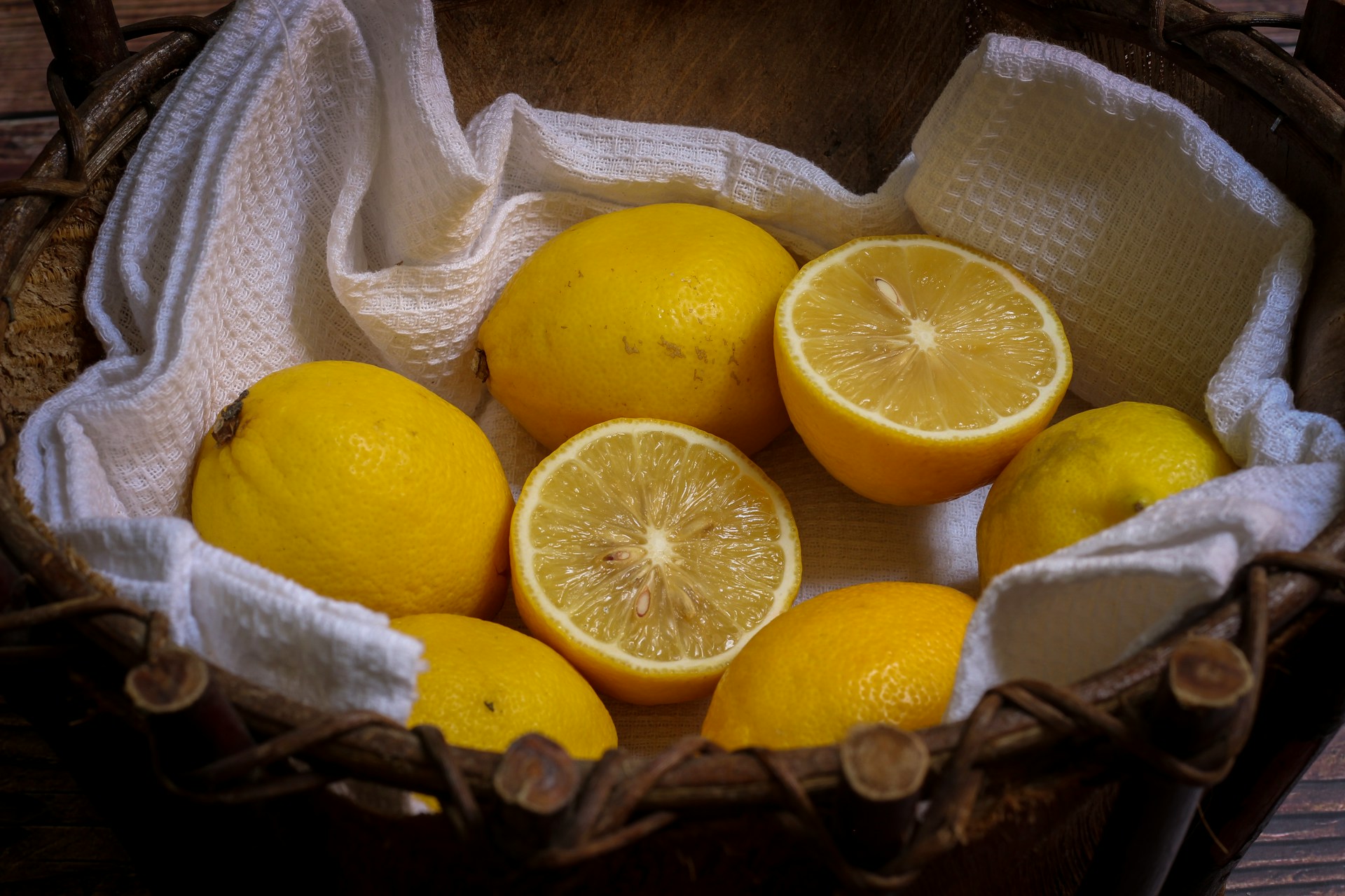 A basket full of yellow lemons