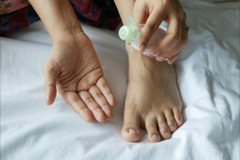 photo of a foot being rubbed with oil